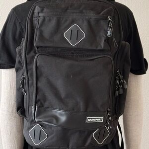 Black Urban-Style Backpack with Durable Material and Modern Design